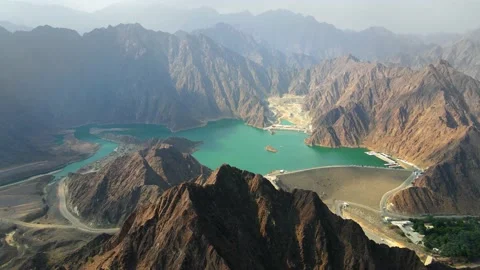 Hatta Dam Lake in eastern region of Dubai, United Arab Emirates aerial view Stock Footage 145344031