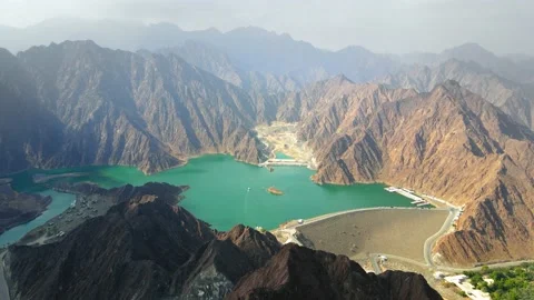 Hatta Dam Lake in eastern region of Dubai, United Arab Emirates aerial view Stock Footage 145344249