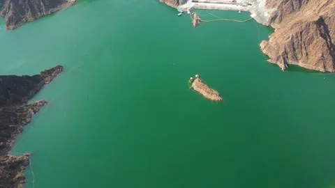 Hatta Dam Lake in eastern region of Dubai, United Arab Emirates aerial view Stock Footage 145344267