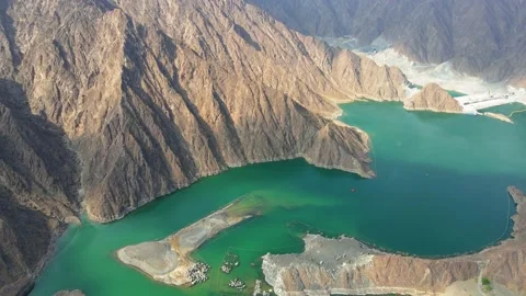 Hatta Dam Lake in eastern region of Dubai, United Arab Emirates aerial view Stock Footage 145344319