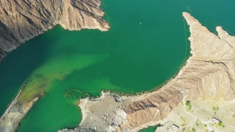 Hatta Dam Lake in eastern region of Dubai, United Arab Emirates aerial view Stock Footage 145344348