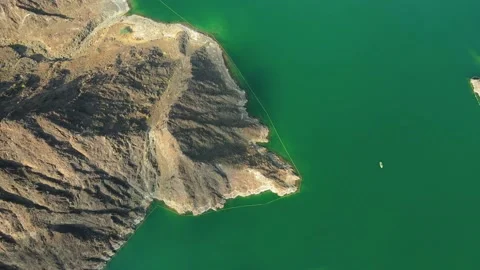 Hatta Dam Lake in eastern region of Dubai, United Arab Emirates aerial view Stock Footage 145344366