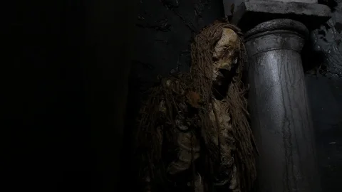 Haunted dead rotting mummy corpse leaning on pillar 動画素材 95961941