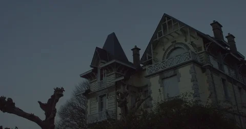 Haunted house in wide low angle shot in a creepy halloween atmosphere with a Stock Footage 110698608