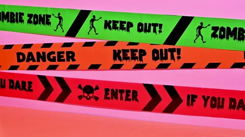 Haunted Stop-Motion Halloween: Skeleton Arms and Barricade Tapes Stock Footage 251650658