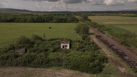 Haunting Drone Exploration of Derelict Railway Side Ruins Stock Footage 335486569