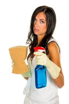  Hausfrau mit Stress beim putzen Eine junge Frau ist unglücklich den Hausp.. Stock Photos