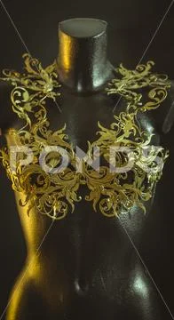 Haute couture, mannequin with piece of corset made with details of gold flour Stock Photos