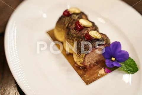 Haute cuisine or high kitchen food concept. Chocolate coated duck liver pate Stock-Fotos