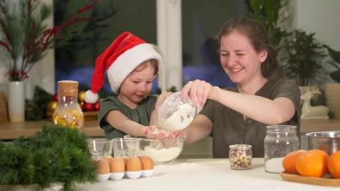 Have fun in kitchen, clap hands with flour on Christmas Eve. Splashes flour fly Video stock 158730809