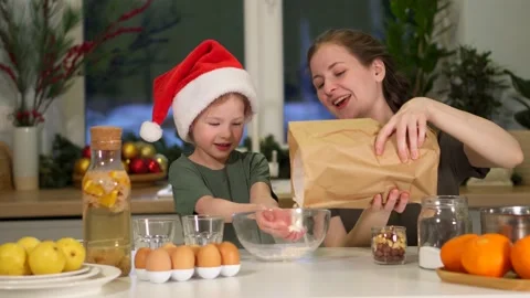 Have fun in kitchen, clap hands with flour on Christmas Eve. Splashes flour fly Video stock 158898564