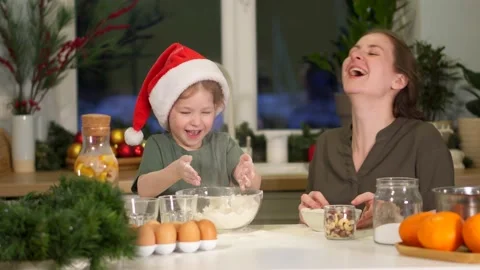 Have fun in kitchen, clap hands with flour on Christmas Eve. Splashes flour fly Video stock 159373011