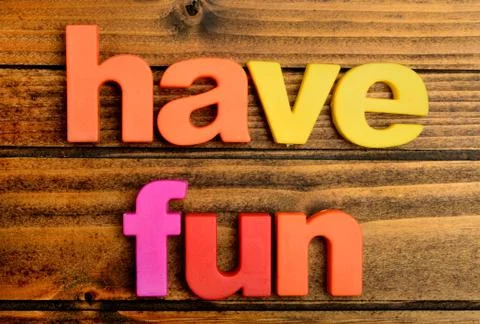 Have fun words on table Stock Photos