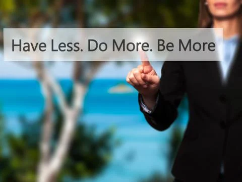 Have Less. Do More. Be More - Businesswoman hand pressing button on touch scr Stock Photos