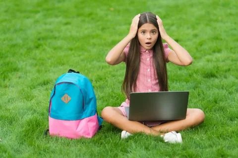 Have some problems. online education. back to school. teen girl use computer on 库存照片