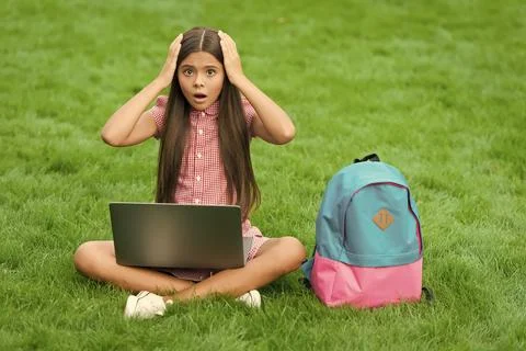 Have some problems. online education. back to school. teen girl use computer on 库存照片