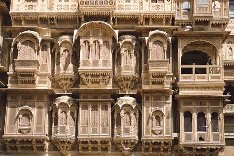 Haveli building has many windows, balconies, art, symmetry, and medieval styl Stock Photos