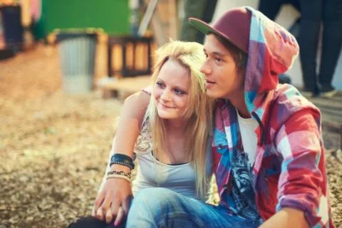 Having the best date ever. an affectionate young couple having a good time at an Stock Photos