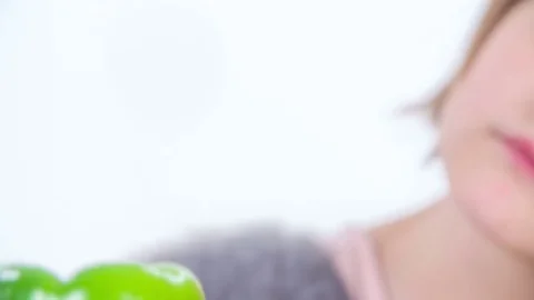 Having a big green pepper in her hand Stock Footage 83725056