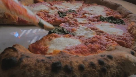 Having a bite from a slice of the whole pizza Stock Footage 87782328