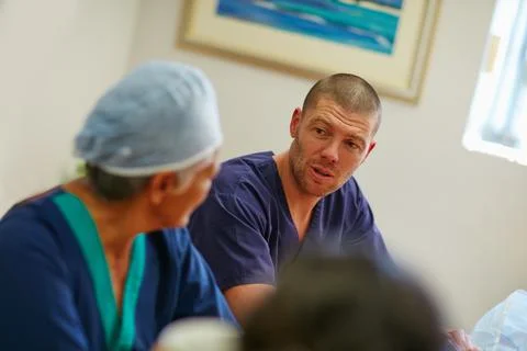 Having a chat over tea time. medical practitioners having a chat while on their Stock Photos