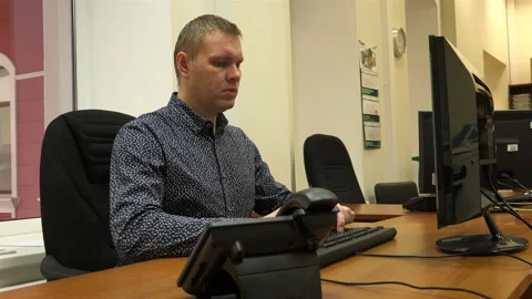 Having completed the work, the young man looked at the screen pretty Stock Footage 111170381