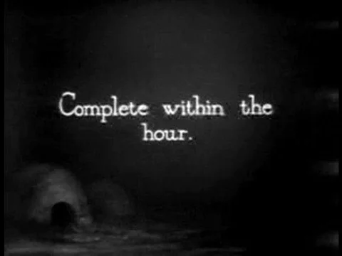 Having finished building an igloo from the inside, an Eskimo carves a doorway Stock Footage 75762642