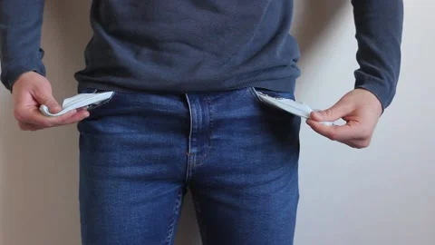 Having found nothing in his pockets, a man tucks his pockets inside. Stock Footage 130638424