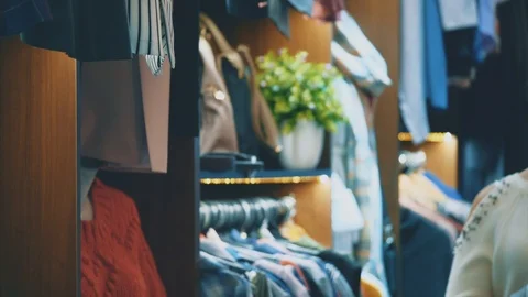 Having found the things she liked, she raises them to her body and enjoys the Stock Footage 102203759