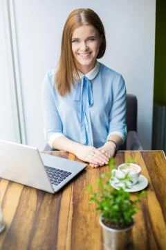Having fun with free internet in cafe Stock Photos