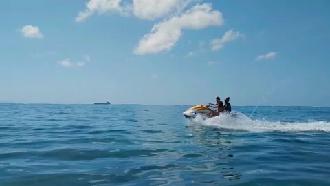 Having fun on jet ski on the beach of Bali Indonesian Stock Footage 170648511