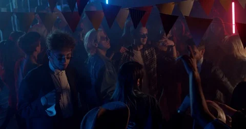 Having fun people dance hanging out enjoying night party at colorful light Stock Footage 115393334