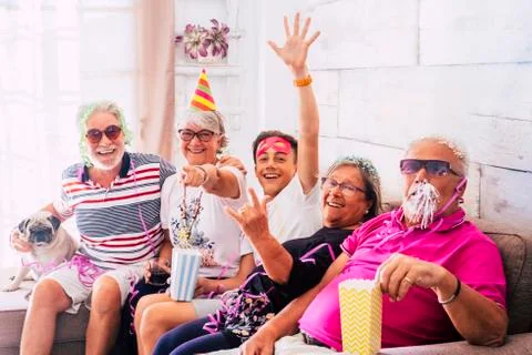 Having fun for people with no age limits at home - grandfathers and grandson  Fotos de archivo