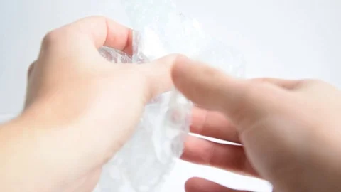 Having fun pooping bubble plastic Stock Footage 129767946