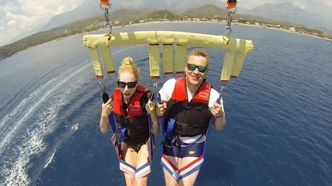 Having fun with water parachute Stock Footage 69874866