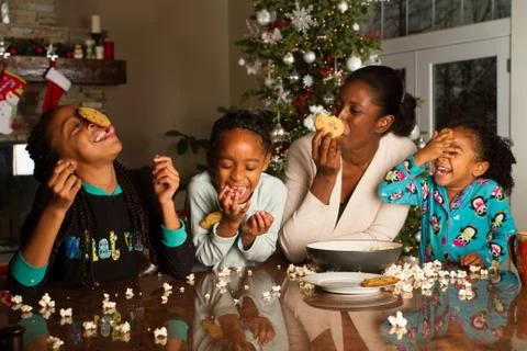 Having fun while trying to eat a cookie off of your head. Foto stock