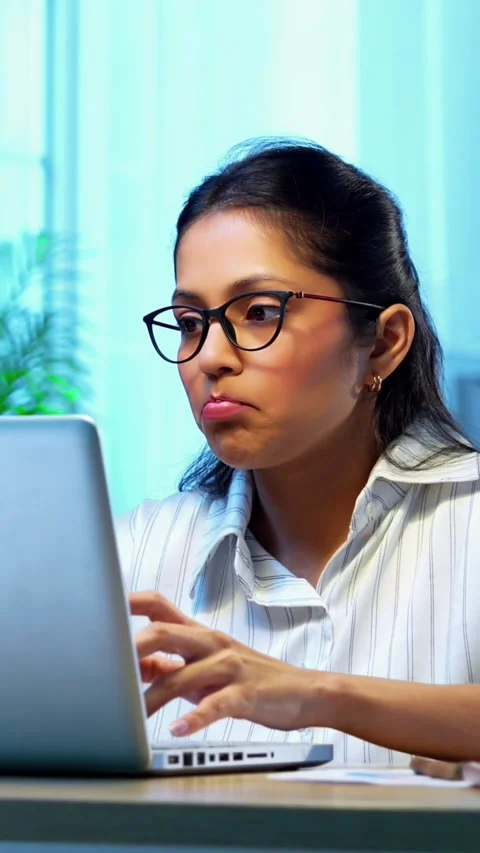 Having headache while working, Indian businesswoman stressed at desk Stock Footage 342572808