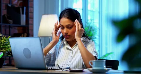 Having headache while working, Indian businesswoman stressed using laptop Stock-Footage 342573686