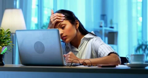 Having headache while working, Indian businesswoman stressed using laptop Stock-Footage 342573694