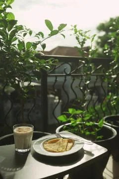 Having a light breakfast at the balcony Stockfoto's