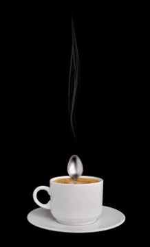 Having a rest spoon in a cup of coffee Stock Photos