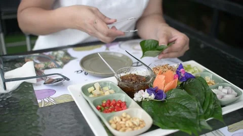 Having a royal leaf wrap appetizer Stock Footage 159430996