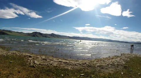 Having Washed the Man Coming Out to Lake Bank Stock Footage 60577792