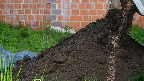 Havy duty dump truck dumping soil Stock Footage 113386726