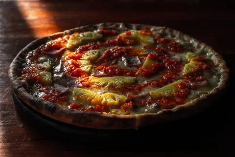 Hawai pizza with tomato sauce on wooden table Stock Photos