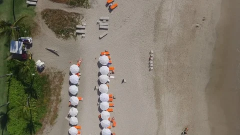 Hawaii beach view top down by drone. Tourist under parasol. Colourful sunshades. Stock Footage 91100008