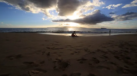 Hawaii boy playing in sand sunset Video stock 33870163