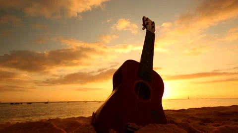Hawaii concept with ukulele on the beach at sunset Stock Footage 58206113