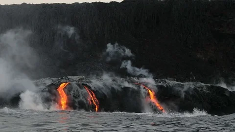 Hawaii Lava flowing into the ocean from volcano lava eruption on Big Island Stock Footage