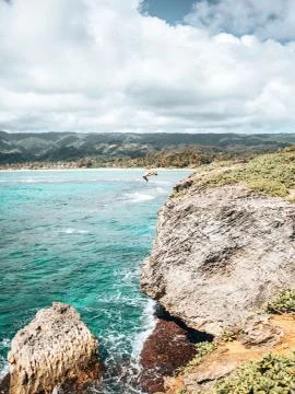 Hawaii Man Flips on Ocean Cliffs Stock Photos